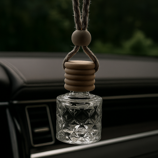 Car air freshener with wooden accents hanging from a car's air vent.